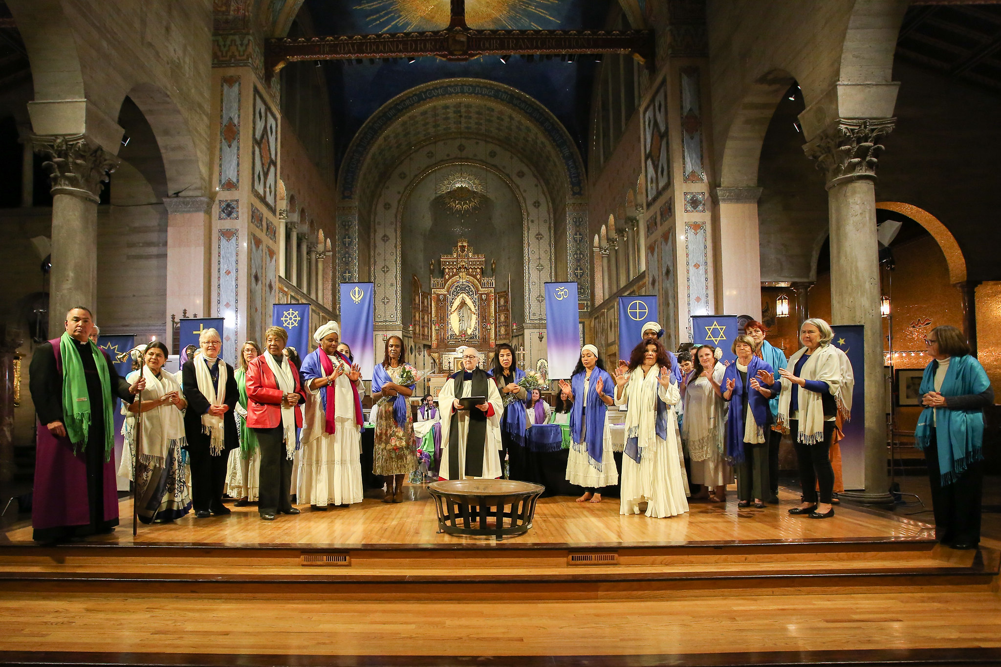Group standing on the stage with Dr. Gwynne