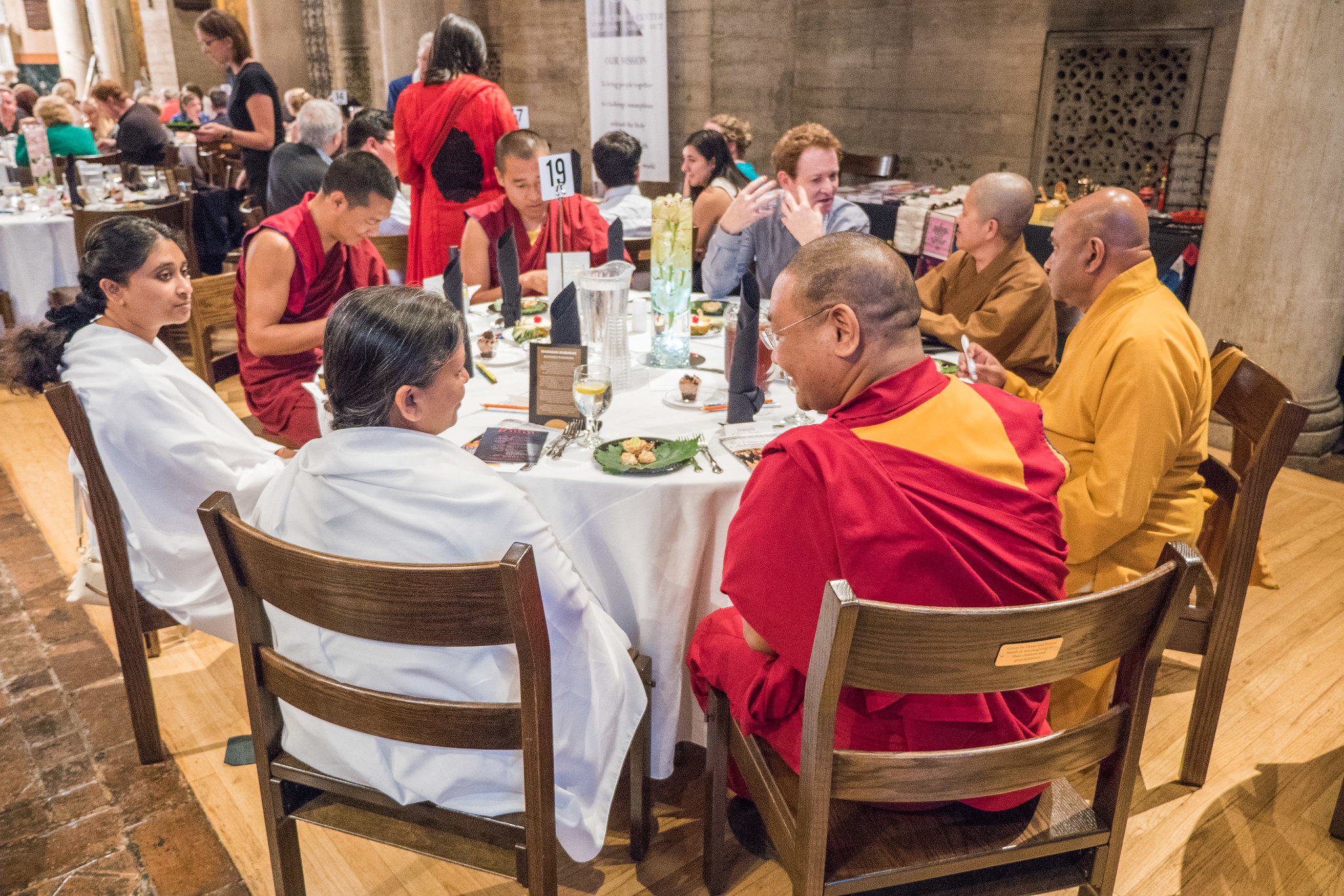 Interfaith sitting around a table